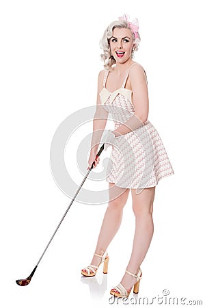 Cute retro girl in mini dress carrying red golf bag over her shoulder, isolated on white with space for text Stock Photo