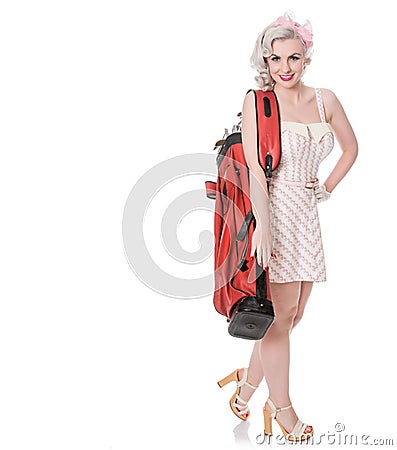 Cute retro girl in mini dress carrying red golf bag over her shoulder, isolated on white with space for text Stock Photo