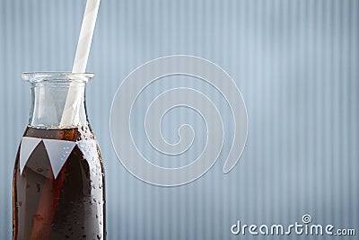 Cute retro soda bottle with cola and straw and background Stock Photo