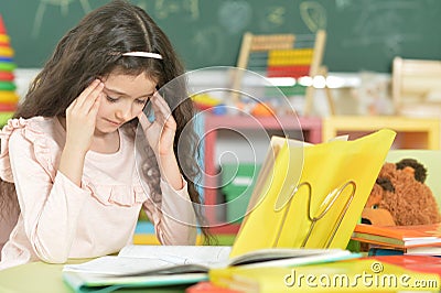 Cute sad little schoolgirl Stock Photo