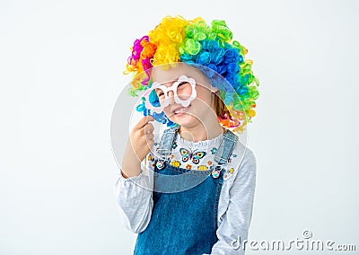 Schoolkid wearing curly wig Stock Photo