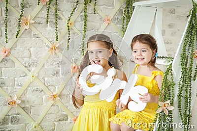 Cute little girls in spring studio Stock Photo