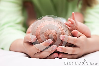 Cute sleeping newborn baby child on mother hands Stock Photo