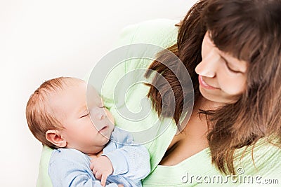 Cute sleeping newborn baby child on mother hands Stock Photo