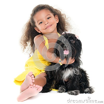 Cute small girl hugging her pet dog Stock Photo