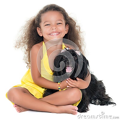 Cute small girl hugging her pet dog Stock Photo