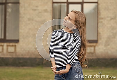Cute small kid with long blond hair wear casual fashion style summer urban outdoors, fashionista, copy space Stock Photo