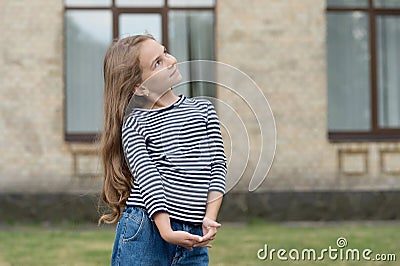 Cute small kid with long blond hair wear casual fashion style summer urban outdoors, fashionista, copy space Stock Photo