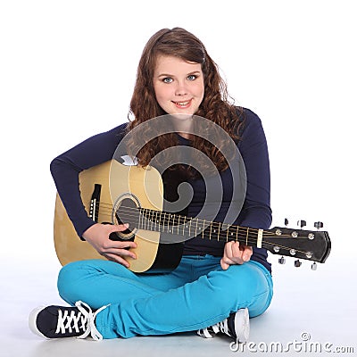 Cute smile by teenager girl on acoustic guitar Stock Photo