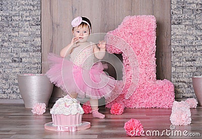 Cute smiling baby girl in pink dress Stock Photo