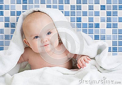 Cute smiling baby kid after bathing in bathroom Stock Photo