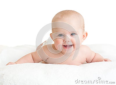 Cute smiling baby lying on white towel Stock Photo