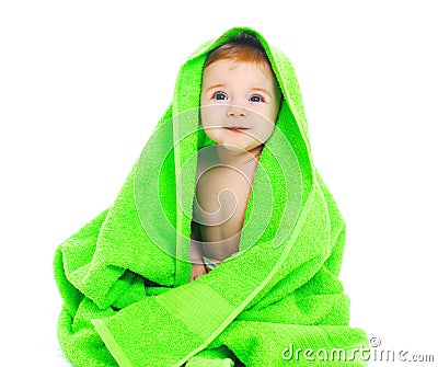 Cute smiling baby under the bright green towel Stock Photo
