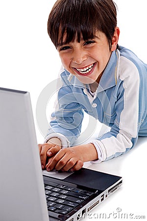 Cute smiling caucasian kid with laptop Stock Photo