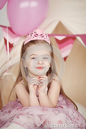 Cute smiling little girl in pink princess Stock Photo