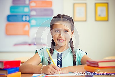 Cute smiling schoolgirl at school Stock Photo