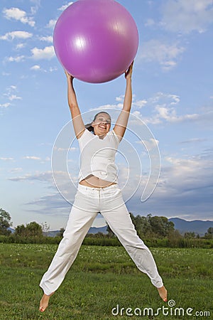 Cute smilling brunettewith the the pink ball Stock Photo