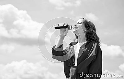 Cute and stylish. having a party. Happy kid with microphone. Singing Songs in karaoke. Lifestyle and People Concept Stock Photo