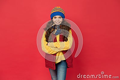 Cute and stylish. Stylish girl red background. Little child with stylish look. Winter style. Fashion and style. Cute and Stock Photo