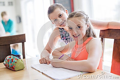 Cute teen girl doing homework at home Stock Photo