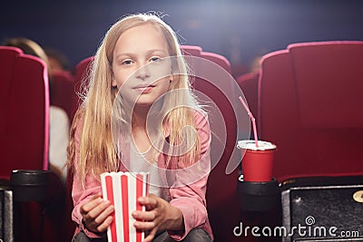 Cute Teenage Girl in Cinema Stock Photo
