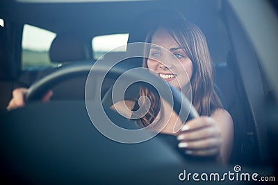 Cute teenager driving her new car Stock Photo