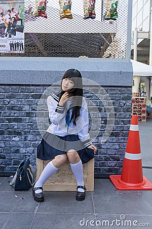 Cute Thai cosplayer dresses as Japanese schoolgirl posing Editorial Stock Photo