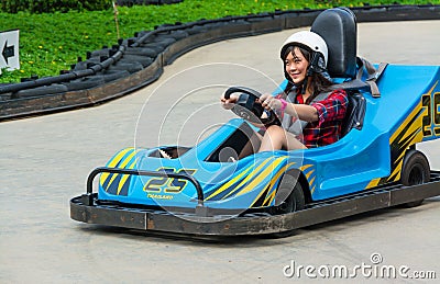 Cute Thai girl is driving Go-kart Stock Photo