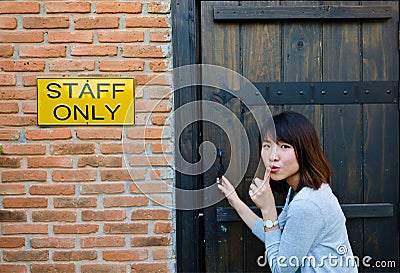 Cute Thai woman is sneaking the secret area Stock Photo