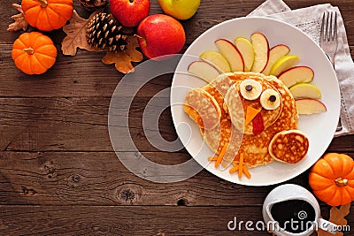 Cute Thanksgiving turkey pancakes, top view corner border against a rustic wood background Stock Photo
