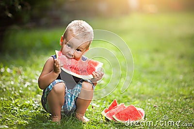 Cute toddler eating a slice of watermelon Stock Photo