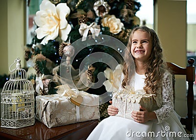 Cute toothless girl rejoices Gift for Christmas Stock Photo