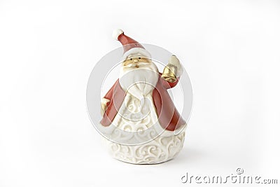 Clay Christmas figure of Santa Claus with golden bell for holiday decorations , Isolated on white background Stock Photo