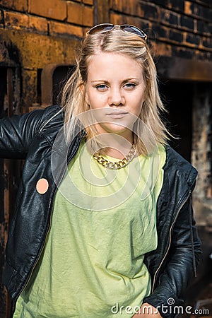 Cute trendy funky young girl looking straight into the camera Stock Photo