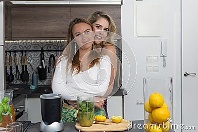Vegan lesbian couple, preparing spinach smoothie. LGTB concept, vegan people Stock Photo