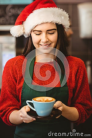 Cute waitress giving a coffee to customer Stock Photo