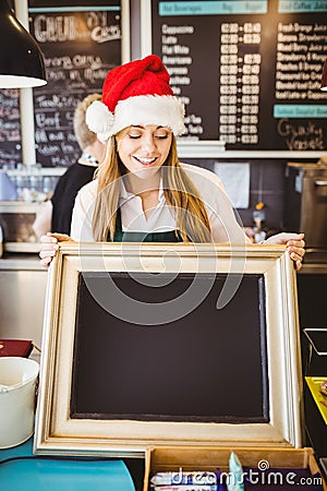 Cute waitress holding a blackboard Stock Photo