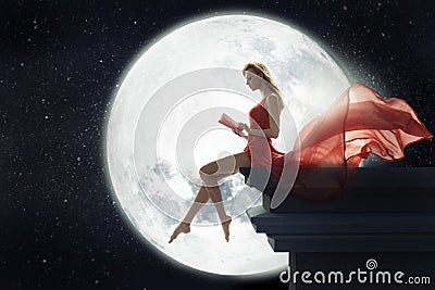 Cute woman over full moon background Stock Photo
