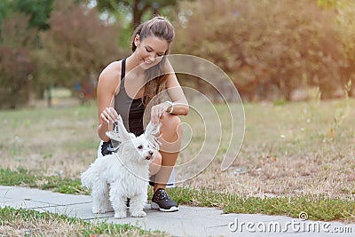 Cute woman play with her dog Stock Photo