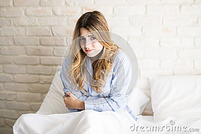 Cute woman with pms Stock Photo