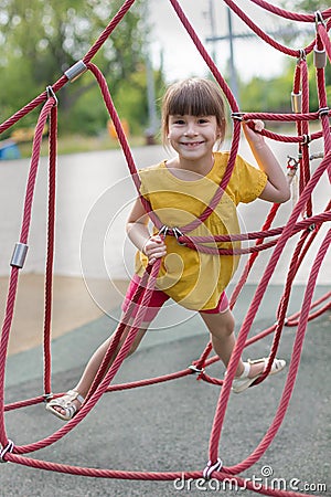 Cute 6 years old todler in the playground Stock Photo