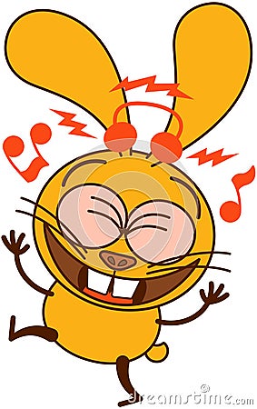 Cute yellow bunny listening to music and dancing Stock Photo