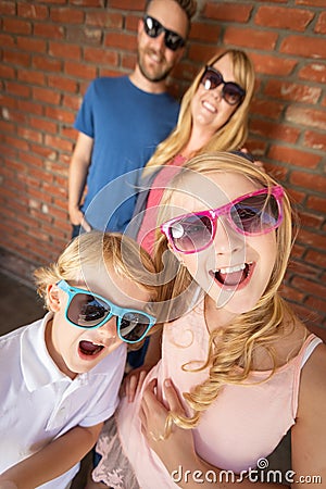 Cute Young Caucasian Brother And Sister Wearing Sunglasses Stock Photo