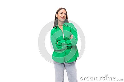 cute young european brown-eyed female model with well-groomed black hair and make-up dressed in a green shirt Stock Photo