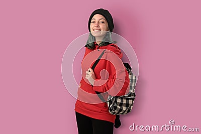 Cute young gilr student with blue hair books and a backpack Stock Photo