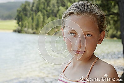Cute Young Girl By Lake Stock Photo