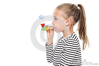 Cute young girl making special exercises at speech therapy office. Child speech therapy concept on white background. Stock Photo