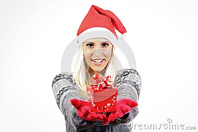 Cute young girl with Santa Claus hat, holding a present Stock Photo