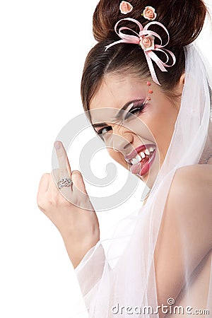 Cute young playful bride showing wedding ring and makes faces Stock Photo