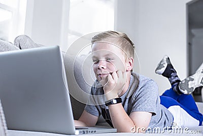 Young student doing online school work from home Stock Photo